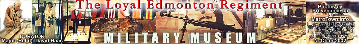 Major (ret-d) David Haas, CD. rmc - curator of Military Museum of the Loyal Edmonton Regiment in Alberta points out Hudson's Bay trade repeating rifle and muskets, as well as war bride display and rest of collection, of uniforms, guns, medals, military needlepoint, and cultural artifacts