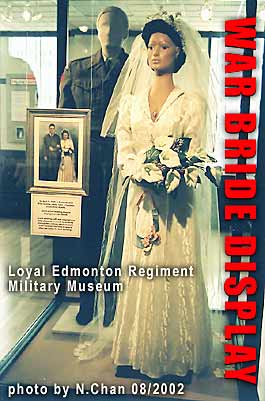 War Bride - bridal gown of Jane Allan who married James Todd, soldier fr. Alberta, in Scotland 1945 - from RATION CLOTHING COUPONS - display case in Edmonton Military Museum